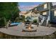 Private backyard oasis with pool, fire pit, waterfall and stone surround at 205 Commodore Ct, Belmont, NC 28012