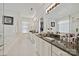 Bright bathroom featuring dual sinks, granite countertops, and ample storage space at 205 Commodore Ct, Belmont, NC 28012