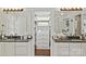 Well-organized bathroom featuring double sinks, granite countertops, and a closet at 205 Commodore Ct, Belmont, NC 28012