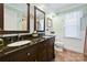 Bathroom with double vanity, granite countertops, and decorative mirrors at 205 Commodore Ct, Belmont, NC 28012