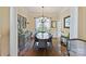 Elegant dining room featuring hardwood floors, natural light, and stylish decor at 205 Commodore Ct, Belmont, NC 28012