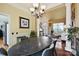 Stylish dining area with large table, hardwood floors, and an open floor plan at 205 Commodore Ct, Belmont, NC 28012