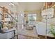 Grand foyer with hardwood floors, chandelier, staircase, and white sofa providing a luxurious and welcoming entrance at 205 Commodore Ct, Belmont, NC 28012