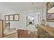 Hallway view leading to a bedroom featuring hardwood floors and decorative art at 205 Commodore Ct, Belmont, NC 28012