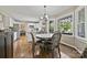 Bright kitchen with hardwood floors, white cabinets, and stainless steel appliances, offering a stylish and functional space at 205 Commodore Ct, Belmont, NC 28012