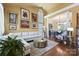 Sun-filled living room with hardwood floors, vaulted ceiling, and stylish furnishings at 205 Commodore Ct, Belmont, NC 28012