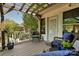 Inviting patio area with comfortable chairs, wooden pergola, and a view of the surrounding trees at 205 Commodore Ct, Belmont, NC 28012