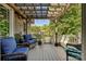 Outdoor patio with wood pergola, and comfortable seating offers a perfect space for relaxation at 205 Commodore Ct, Belmont, NC 28012