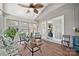 Comfortable sunroom with natural light and many windows, great for relaxing and enjoying the views at 205 Commodore Ct, Belmont, NC 28012