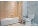 Cozy bathroom featuring a tiled shower-tub and a toilet at 2113 London Ln, Belmont, NC 28012