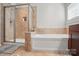 Bathroom featuring separate shower, tub, and tile accents at 2113 London Ln, Belmont, NC 28012