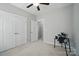 Spare bedroom offering neutral paint, ceiling fan, and closet at 2113 London Ln, Belmont, NC 28012