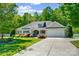 Charming single-story home with a well-maintained front yard, a two car garage, and a cozy, inviting appearance at 2113 London Ln, Belmont, NC 28012