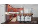 Modern kitchen with stainless steel appliances, sleek countertops, and dark wood cabinets, offering a stylish cooking space at 2113 London Ln, Belmont, NC 28012