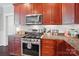Well-equipped kitchen with stainless steel appliances, including a gas range, and granite countertops, great for cooking at 2113 London Ln, Belmont, NC 28012