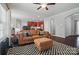 Stylish living room with an open layout flowing into the kitchen, featuring hardwood floors and modern decor at 2113 London Ln, Belmont, NC 28012