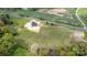 Expansive aerial view of a home site with a newly constructed house amid lush greenery and open fields at 2133 Tite Rd, Stanfield, NC 28163