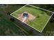 An aerial view of a gray two-story home on a large green lot with a long driveway at 2133 Tite Rd, Stanfield, NC 28163