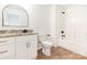 Bathroom featuring granite countertops, white cabinets with gold hardware, and a tub shower at 2133 Tite Rd, Stanfield, NC 28163