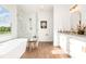 Modern bathroom showcasing a freestanding tub, a glass shower, double vanity with granite countertops at 2133 Tite Rd, Stanfield, NC 28163