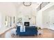 A bright living room features a fireplace, vaulted ceiling, light wood floors, and stylish furnishings at 2133 Tite Rd, Stanfield, NC 28163