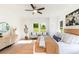 Inviting main bedroom showcasing a queen-sized bed, accent chairs, large windows, and wood flooring at 2133 Tite Rd, Stanfield, NC 28163