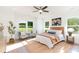 Inviting main bedroom with a queen-sized bed, accent chairs, large windows and an area rug at 2133 Tite Rd, Stanfield, NC 28163