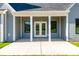 Covered patio with white columns and view of the backyard at 2133 Tite Rd, Stanfield, NC 28163