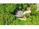 Aerial view showcasing the home surrounded by lush, mature trees and a private lot at 2417 Labelle Dr, Waxhaw, NC 28173