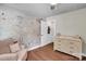 Charming bedroom with a world map mural and a cozy armchair at 2417 Labelle Dr, Waxhaw, NC 28173