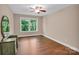 Bedroom featuring hardwood floors, natural light, and ample space at 2417 Labelle Dr, Waxhaw, NC 28173