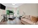 Spacious bonus room featuring a treadmill, bikes, sofa, and natural light at 2417 Labelle Dr, Waxhaw, NC 28173