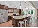 Spacious kitchen featuring a large island with bar seating, stainless steel appliances, and stylish pendant lighting at 2417 Labelle Dr, Waxhaw, NC 28173