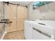 Modern laundry room featuring barn doors, a washer and dryer, and a wire shelf at 2417 Labelle Dr, Waxhaw, NC 28173