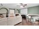 Spacious living room featuring a projector screen, wet bar, and hardwood floors at 2417 Labelle Dr, Waxhaw, NC 28173
