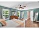 Bright and airy main bedroom featuring wooden floors, a ceiling fan, and abundant natural light at 2417 Labelle Dr, Waxhaw, NC 28173