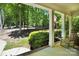 Inviting front porch with rocking chair, shrubbery, and an American flag at 2417 Labelle Dr, Waxhaw, NC 28173