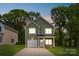 Charming two-story home with a well-manicured lawn and a welcoming front porch at 3056 Goble St, Gastonia, NC 28056