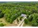 Lush aerial view of house on expansive tree-lined lot, highlighting curb appeal and seclusion at 3179 Westview Rd, Concord, NC 28025