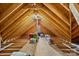 Spacious unfinished attic with exposed rafters, storage solutions, and ample room for organization at 3179 Westview Rd, Concord, NC 28025