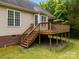 Home with a wooden back deck and stairs to the backyard, ideal for outdoor enjoyment at 3179 Westview Rd, Concord, NC 28025