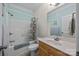 Cozy bathroom features a shower-tub combo and classic vanity with marble countertop at 3179 Westview Rd, Concord, NC 28025