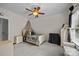 Well-lit bedroom featuring neutral carpet, decorative elements and a ceiling fan at 3179 Westview Rd, Concord, NC 28025