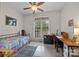 Bright bedroom with a ceiling fan, natural light, a desk and guitars for a musician at 3179 Westview Rd, Concord, NC 28025