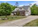 Beautiful brick and vinyl home featuring a manicured lawn and attached two-car garage at 3179 Westview Rd, Concord, NC 28025