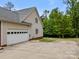 Exterior of a home featuring a garage, driveway, and side yard with mature trees at 3179 Westview Rd, Concord, NC 28025