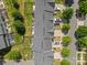Aerial view showcases townhomes with individual driveways, landscaping, and well-maintained lawns at 3245 Major Samuals Way, Charlotte, NC 28208