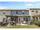 Charming backyard with a pergola-covered patio, comfortable seating, and well-maintained lawn at 3245 Major Samuals Way, Charlotte, NC 28208