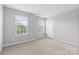 Bright bedroom featuring two windows with a neutral color palatte at 3245 Major Samuals Way, Charlotte, NC 28208