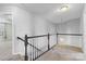 Bright upper level hallway with a view of the stairwell and bedrooms at 3245 Major Samuals Way, Charlotte, NC 28208